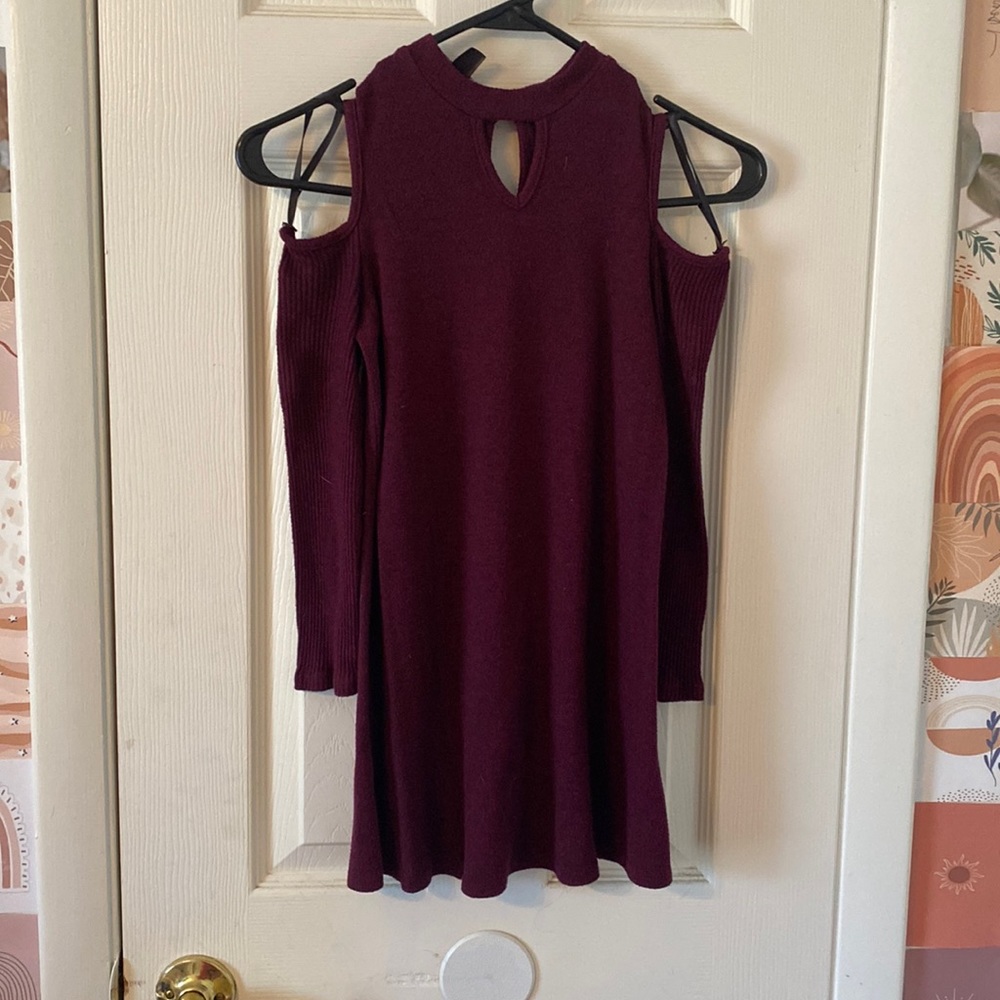 Long sleeve shirt with an open shoulder (includes straps).